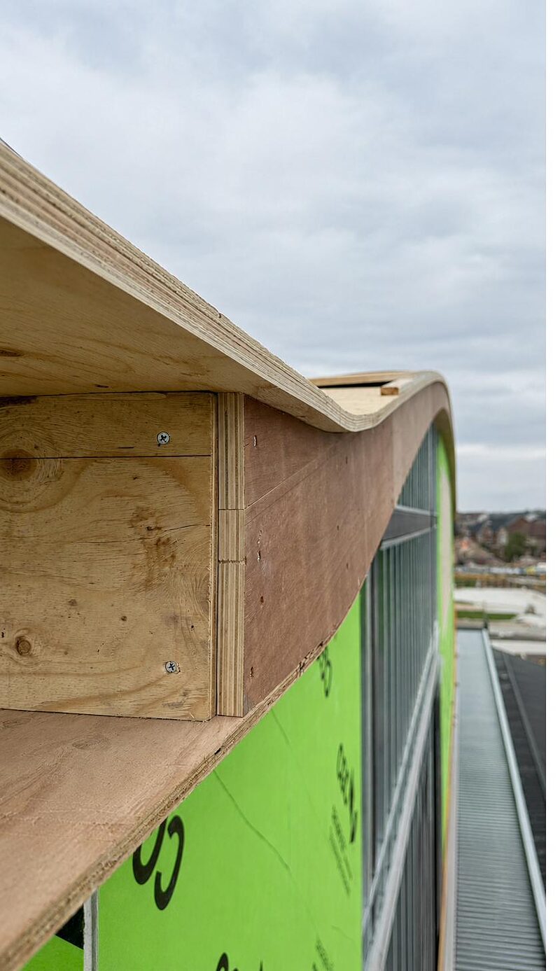 Parapet cap and sheathing detail at a rooftop edge