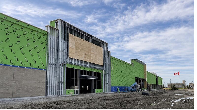 Exterior sheathing and steel-stud framing on a commercial elevation
