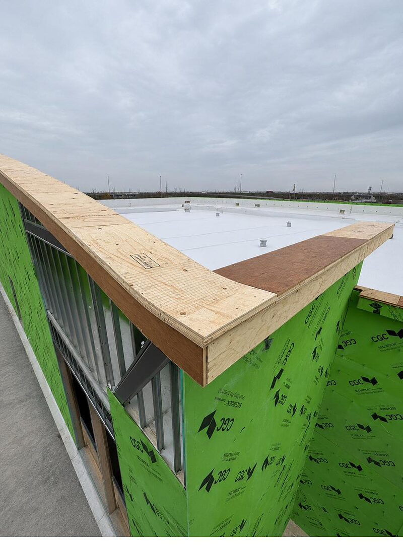 Parapet and sheathing detail at a rooftop corner
