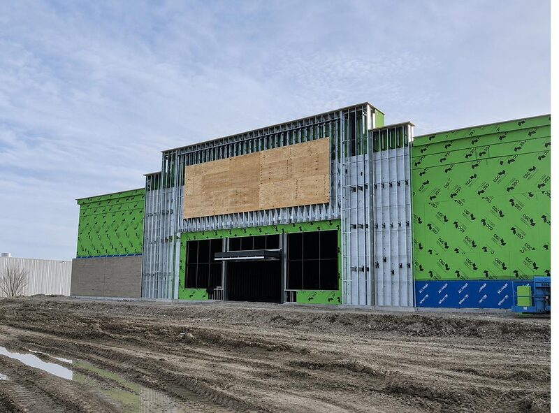 Exterior framing and sheathing at a commercial building entrance