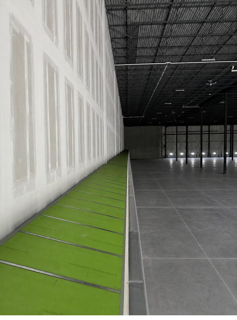 Tall finished drywall assembly in a commercial interior