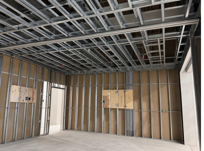 Interior steel-stud partitions with ceiling framing